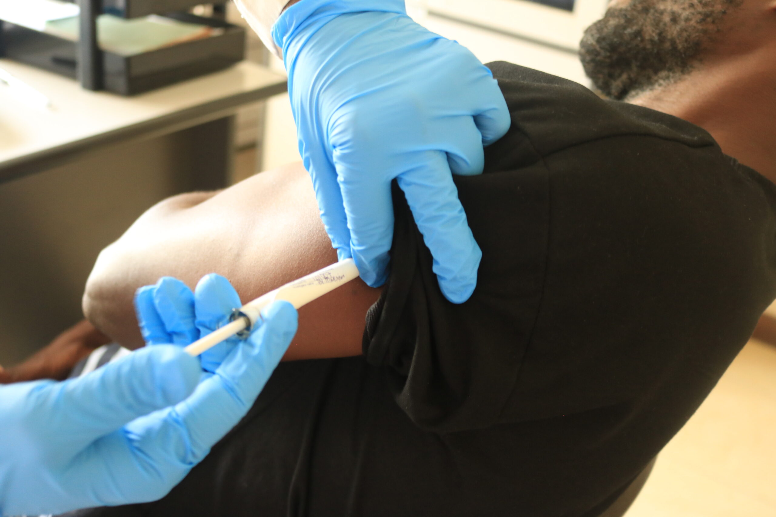 Administration of study vaccine to a MOCHI study participant